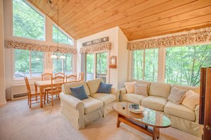 Lots of natural light surrounded by trees with views of Loon Mountain.