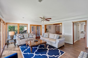 Main level living room with all of windows.