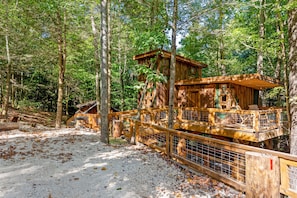 Amazonia Cabin in Red River Gorge is an elevated treehouse structure for couples or families to enjoy.