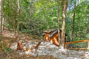 Amazonia treehouse rentals firepit in Red Rover Gorge. Comfy and cozy at the campsite.