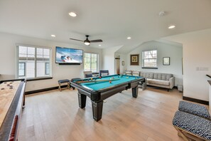 Game room with pool table, shuffleboard, large smart TV with Sonos sound bar