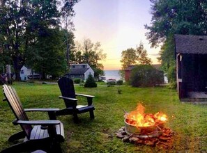 We have great fire pit and plenty of chairs to enjoy it.  You are a short walk to the public beach access for the homes.   You  back to a state park that runs along the lake as well.  And only 3 miles from Sodus Point for a Sandy public beach! 