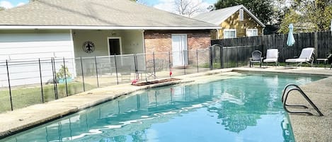 Relax in the private fully fenced gunite pool.