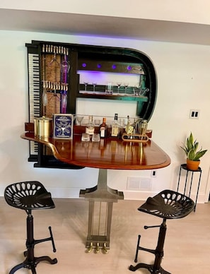 This was my Grandma’s piano that she had for 70 years and my Dad made it into a bar! We provide wine, champagne, whiskey, shot, cordial and martini glasses as well as a full bar set with ice bucket and cocktail recipe book!