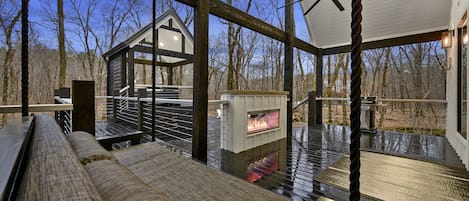 Swing bed next to fireplace is perfect for evening and early morning snuggles