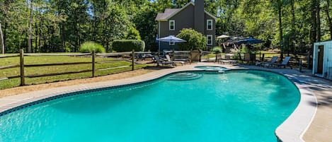 Welcome to this DC Retreat! A 5BR home with large, heated pool sitting on 8 wooded acres close to wineries, hiking, and history