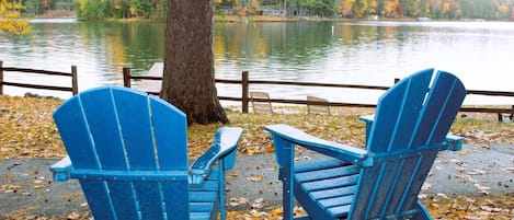 Relax in Adirondack chairs by the lake at your cabin.