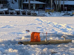 Watch tip ups, while staying cozy at the COZY BEAR LODGE.