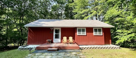 Bear Lodge cabin surrounded by trees.