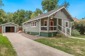 Clean garage space, long driveway for vehicles, front porch seating, well lit