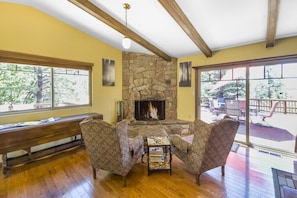 Nestled in front of the wood burning fireplace, these arm chairs are perfect for cozying up on cold nights.