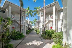 Pathway from parking lot to condo, straight to the end and on the right.