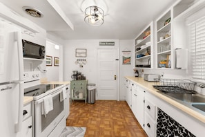 This kitchen is fully stocked with everything you need for cooking plus spices!
