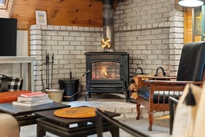 Get a true sense of the mountain life here in this cozy living space as you snuggle up in a blanket by the warmth of the fire.
