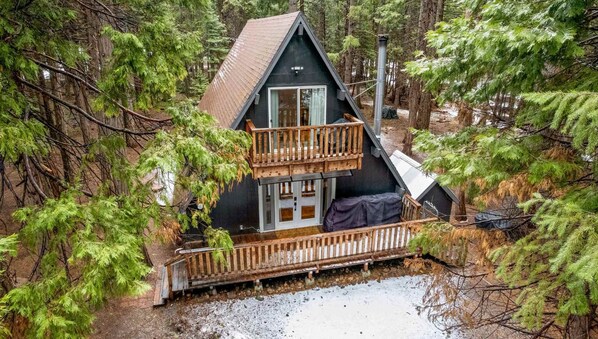 A classic A-frame Cabin located in a beautiful neighborhood near Lassen Volcanic National Park with wood decks that are perfect for stargazing at night.
