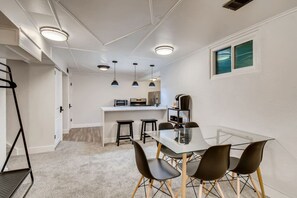 Bright dining area with views of both the kitchen and living room.