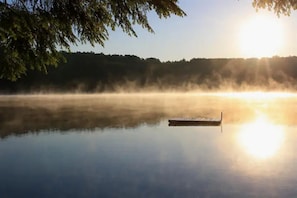 Our swim dock in the early morning mist. Photo by John Silva.