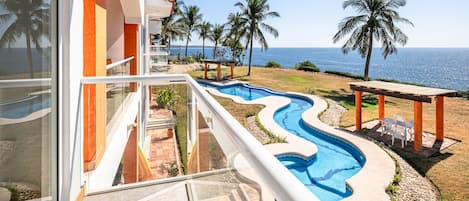 Private balcony overlooks shared back yard and pool. 6 units that share the pool