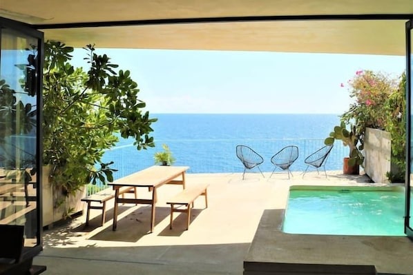 View from your living area to the private terrace and private pool