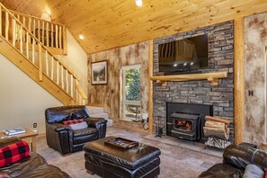 Another view of the main living area with stairs to the second level