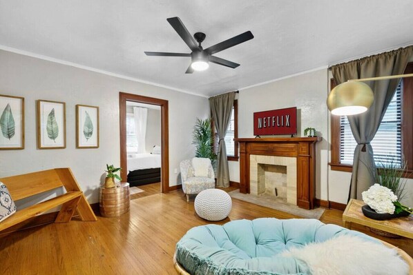 Indulge in your beautiful and spacious living room while relaxing or enjoying watching Netflix.