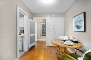 The dining room area for sharing your home-cooked meals. This angle shows the door leading to your kitchen.