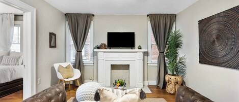 Picture-perfect view of the living room with Smart TV connected to Netflix and Youtube. Love the beautiful wall decor that enhances the total feel of the space.