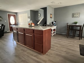 Kitchen island and coffee station/breakfast nook.