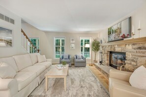 Main living space with natural wood burning fire place