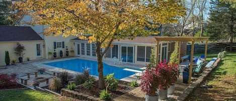Large pool, fireplace, and fenced in yard.