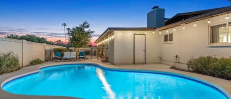 Private backyard with an outdoor pool