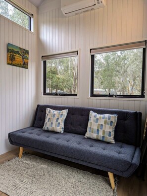 Sofa couch which folds flat for third person to sleep