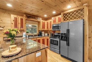 This kitchen is fully stocked for your stay with us.