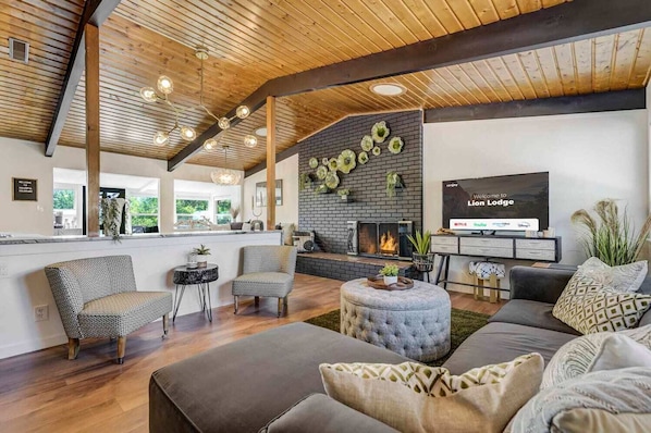 The open layout between the living room, kitchen, and dining room  is perfect for large groups traveling together to enjoy each other's company.