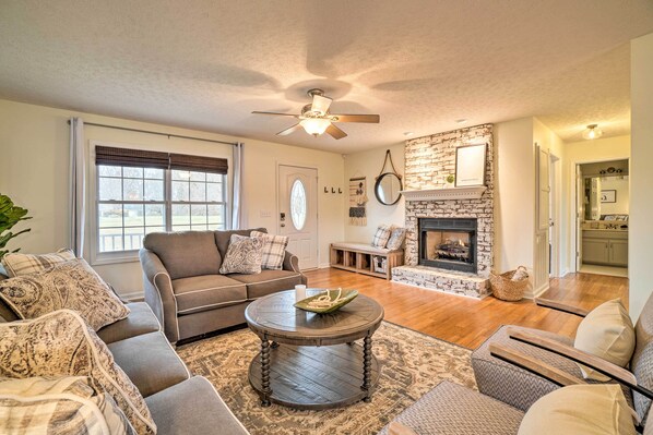 Comfortable living room with gas burning fireplace. 