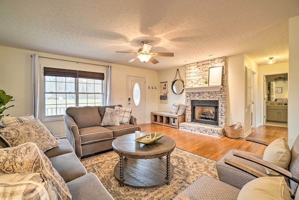 Comfortable living room with gas burning fireplace. 