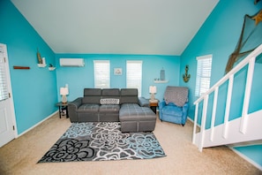 Specious living room.The couch pulls into a bed perfect for 2 littles or 1 Adult