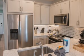 Curb your appetite by cooking a meal in your kitchen.