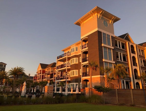 The resort captured in the warm light of sunset, highlighting its grandeur and serene location.