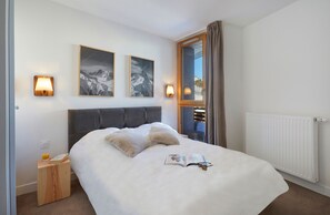 Relax on the comfy bed after a day outside.