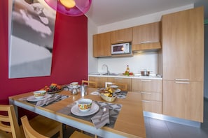 view on dining table and kitchen