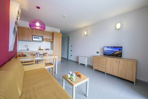 living room with kitchen and dining table view