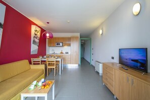 living room with kitchen and dining table view