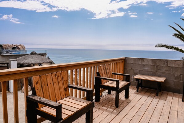 Oceanside private patio, public access to beach, safe for swimming and surfing. 