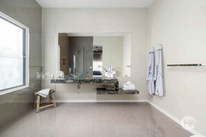 Studio One - large, bright bathroom with walk-in shower