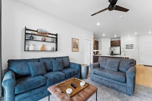 The living area includes a queen and twin size sleeper sofa.