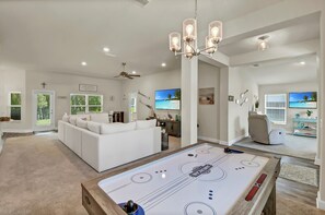 Air Hockey table for hours of Family fun. Lounge on the couch and watch the kids