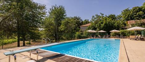 South-facing pool (6m x 14m. Deep 1.20m to 2.20) With long chairs, parasol.