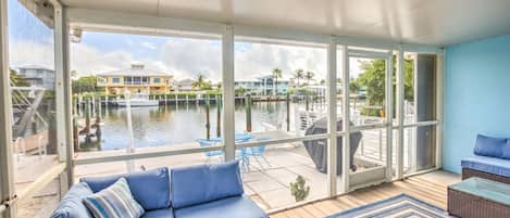 Canal front screened in lanai with all new outdoor furniture