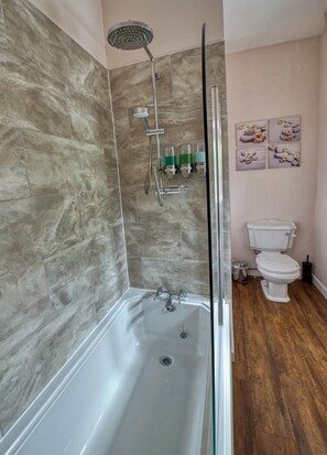 Ground floor bathroom with shower over bath